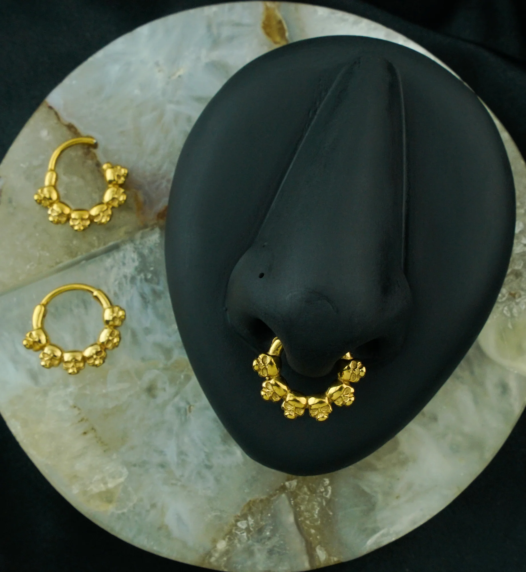 Gold PVD Ring Of Skulls Stainless Steel Hinged Segment Ring - Mrs Treak